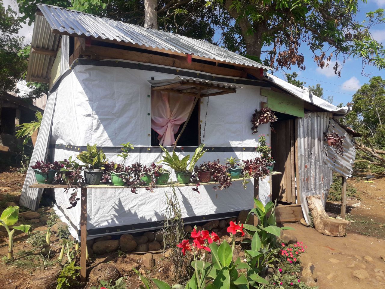 A shelter has been built in the Philippines using a ShelterKit with a garden in front