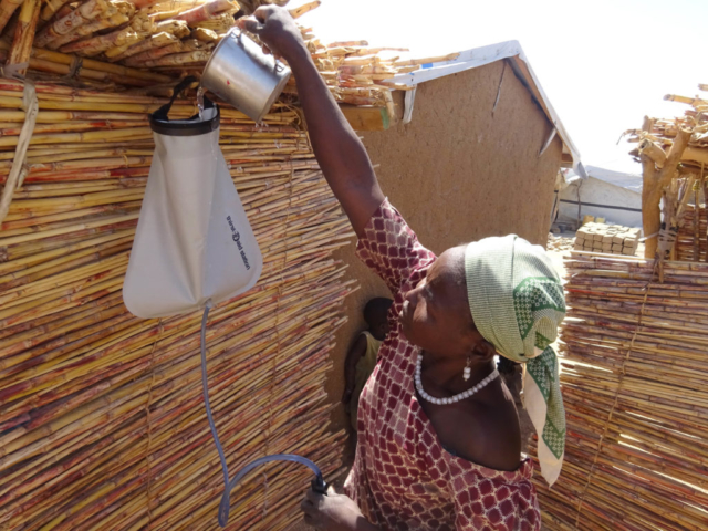 Maïramu from Cameroon fills her water filter