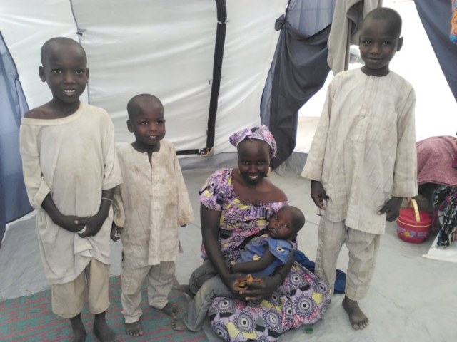 Mode takes care of her four children at a refugee camp in Cameroon
