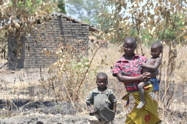 Alefa with her two children in Malawi