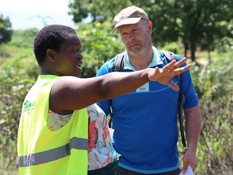 Miriam in Malawi, speaking with a ShelterBox Response Team Member.