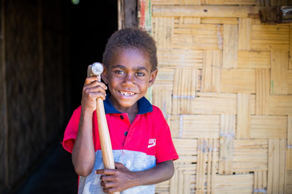 Patrick's son John, holding a hammer