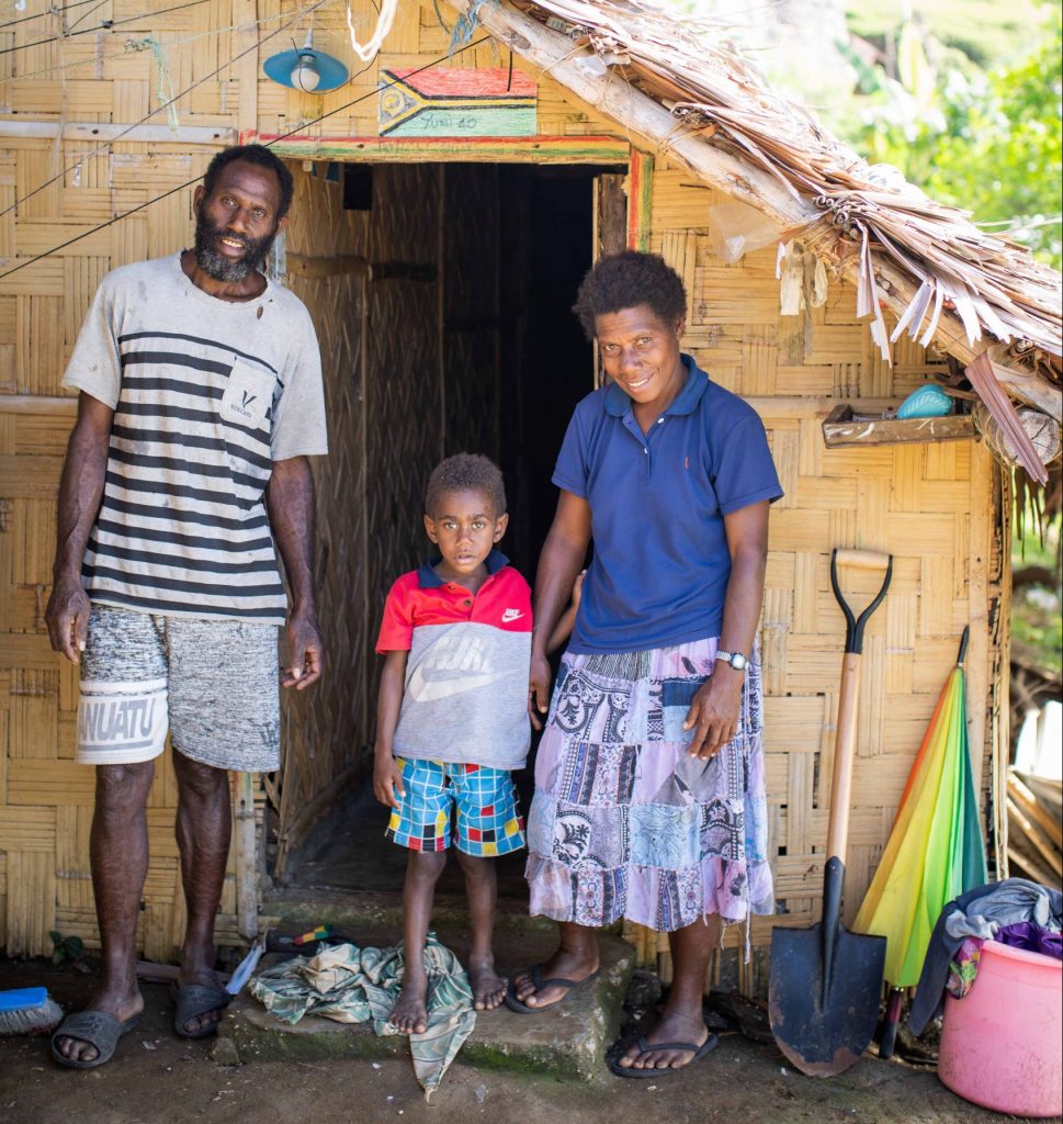 Patrick Buleban with his wife Sebastiana and son John outside their home.