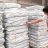 A man inspects ShelterBox aid items piled in a warehouse