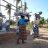 Two women carry ShelterBox aid on her head