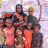 Samira and her six children outside their temporary shelter